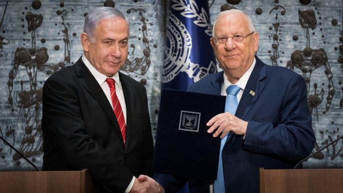 Israel's President Reuven Rivlin presents Israeli Prime Minister Benjamin Netanyahu with the mandate to form a new government on Sept. 25, 2019. Photo by Yonatan Sindel/Flash90
