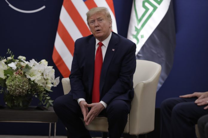US President Donald Trump speaks during a meeting with his Iraqi counterpart Barham Salih at the World Economic Forum in Davos, Switzerland, Wednesday, Jan. 22, 2020. Trump's two-day stay in Davos is a test of his ability to balance anger over being impeached with a desire to project leadership on the world stage. (AP Photo/Evan Vucci)