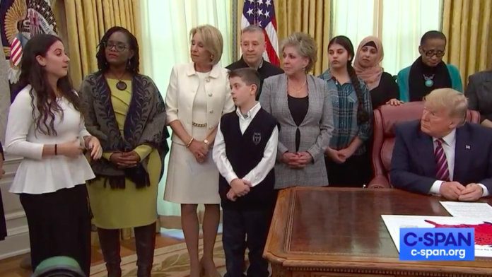 Ariana Hoblin, a Jewish public-school student from Florida, tells U.S. President Donald Trump about being bullied in middle school for her religion. It took place during a ceremony in the Oval Office when Trump signed an executive order to better protect prayer in public schools and federal funds for religious organizations on Jan. 16, 2020. Source: Screenshot