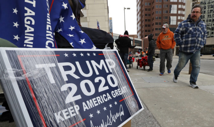 Supporters of President Donald Trump walk to the venue before he speaks during a campaign rally at the Huntington Center, Thursday, Jan. 9, 2020, in Toledo, Ohio. (AP Photo/Tony Dejak)