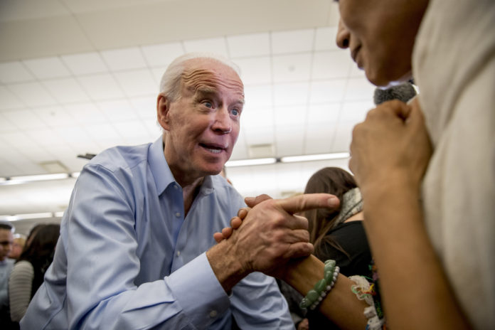 Democratic presidential candidate former Vice President Joe Biden greets members of the audience at a campaign stop at the South Slope Community Center, Saturday, Feb. 1, 2020, in North Liberty, Iowa. (AP Photo/Andrew Harnik)