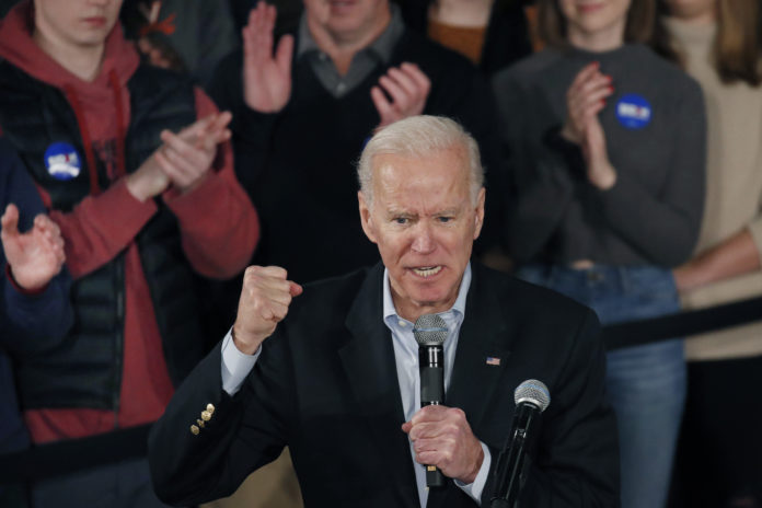 Democratic presidential candidate former Vice President Joe Biden clenches his fist as he speaks at a campaign event, Saturday, Feb. 8, 2020, in Manchester, N.H. (AP Photo/Elise Amendola).