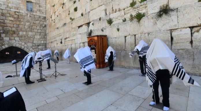The Priestly Blessing for Passover is recited at the Western Wall by a limited number of kohanim due to the current coronavirus pandemic, on April 12, 2020. (Haim Zach/GPO and The Western Wall Heritage Foundation)