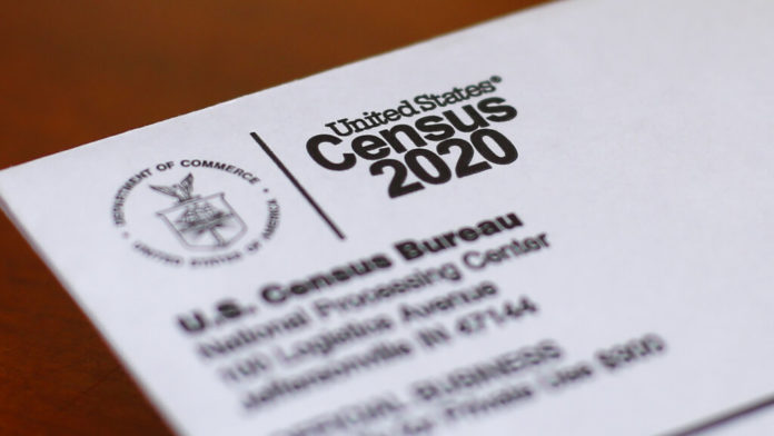 FILE - In this Sunday, April 5, 2020 file photo, An envelope containing a 2020 census letter mailed to a U.S. resident is shown in Detroit. A top lawmaker says the Trump administration is seeking to delay deadlines for the 2020 census because of the coronavirus outbreak. U.S. Rep. Carolyn Maloney said Monday, April 13, 2020 that administration officials also were asking that the timetable for releasing apportionment and redistricting data used to draw congressional and legislative districts be pushed back. (AP Photo/Paul Sancya, File)