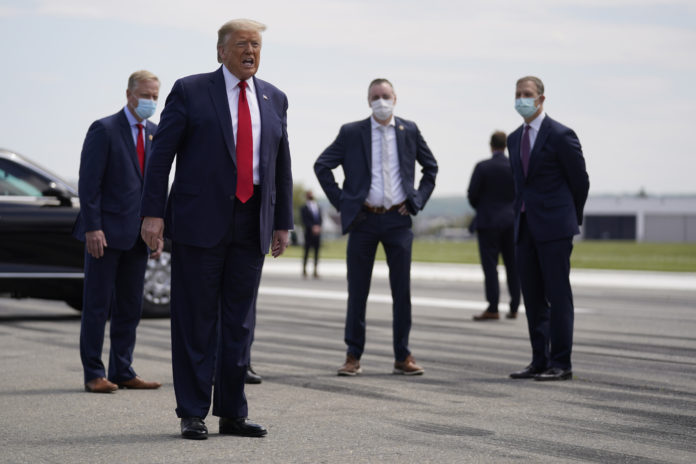 President Donald Trump speaks after exiting Air Force One at Lehigh Valley International Airport in Allentown, Pa., Thursday, May 14, 2020. (AP Photo/Evan Vucci)