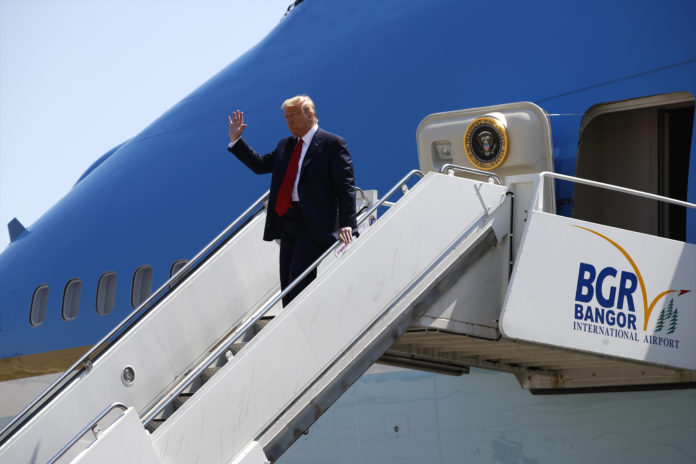 President Donald Trump waves as he arrives at Bangor International Airport in Bangor, Maine, Friday, June 5, 2020. (AP Photo/Patrick Semansky)