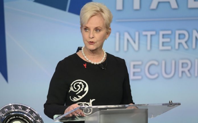 FILE - In this Nov. 17, 2018 file photo, Cindy McCain pauses while presenting the inaugural John McCain Prize for Leadership in Public Service to the People of the island of Lesbos, Greece at the Halifax International Security Forum in Halifax, Canada. (Darren Calabrese /The Canadian Press via AP)