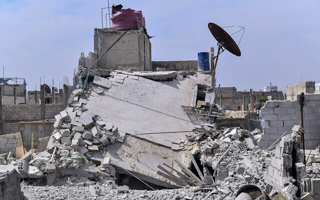 Illustrative: This photo released by the Syrian official news agency SANA, shows the rubble of a house that according to the Syrian authorities was attacked by an Israeli airstrike, in the Damascus suburbs of Hajira, Syria, Monday, April 27, 2020. (SANA via AP)