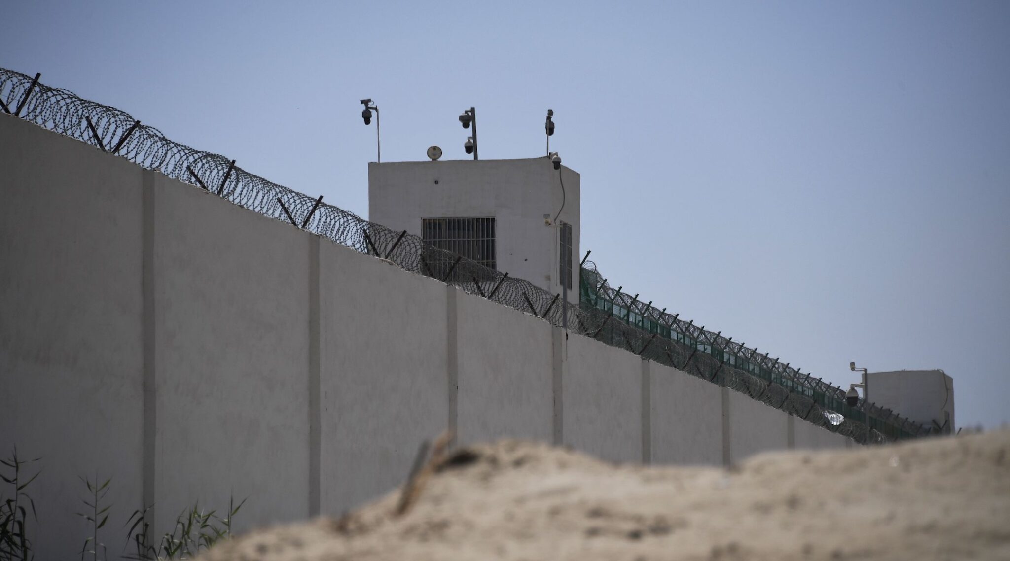 This photo taken on May 31, 2019 shows the outer wall of a complex that includes what is believed to be an internment camp full of ethnic Muslims, on the outskirts of Hotan, in China’s northwestern Xinjiang region. (Greg Baker/AFP via Getty Images)