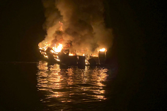 FILE - In this Sept. 2, 2019, file photo provided by the Santa Barbara County Fire Department, the dive boat Conception is engulfed in flames after a deadly fire broke out aboard the commercial scuba diving vessel off the Southern California Coast. The captain of a scuba diving boat that burned and sank off the California coast, killing 34 people below deck, has pleaded not guilty to federal manslaughter charges. Jerry Boylan surrendered Tuesday, Feb. 16, 2021, and was arraigned in Los Angeles federal court on 34 counts of seaman's manslaughter. (Santa Barbara County Fire Department via AP, File)