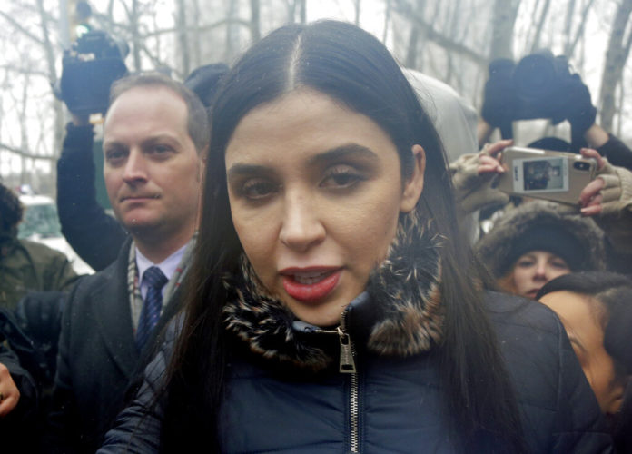 FILE - In this Feb. 12, 2019 file photo, Emma Coronel Aispuro, center, wife of Joaquin "El Chapo" Guzman, leaves federal court in New York. The wife of Mexican drug kingpin and escape artist Joaquin “El Chapo” Guzman has been arrested on international drug trafficking charges at an airport in Virginia. The Justice Department says 31-year-old Emma Coronel Aispuro, who is a dual citizen of the U.S. and Mexico, was arrested at Dulles International Airport on Monday and is expected to appear in federal court in Washington on Tuesday. (AP Photo/Seth Wenig)