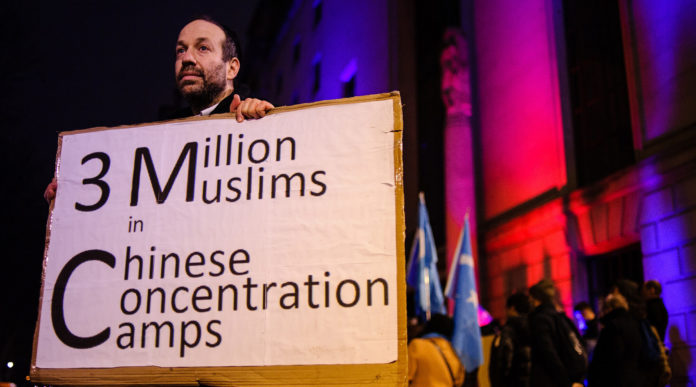 A Jewish man who identified himself as Andrew protests the oppression of China's Uighurs outside the Chinese Embassy in London, Jan. 5, 2020. (David Cliff/NurPhoto via Getty Images)
