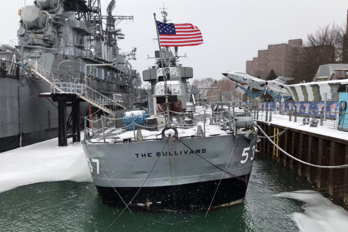This photo, provided by the Buffalo and Erie County Naval & Military Park, in Buffalo, NY, on Tuesday, March 16, 2021, shows the destroyer USS The Sullivans, that's taking on water and listing at its dock in Buffalo's inner harbor and began emergency repairs. The 78-year-old vessel is named in honor of the five Sullivan brothers from Waterloo, Iowa, who were killed in action when the USS Juneau was sunk by the Japanese in the South Pacific during World War II. (Buffalo and Erie County Naval & Military Park via AP)