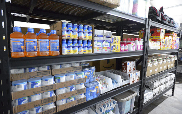 Shelves inside a storage room are stocked with items for infants during an open house at the U.S. Border Patrol Yuma Sector processing facility Tuesday, April 20, 20201, in Yuma, Ariz. (Randy Hoeft/The Yuma Sun via AP)